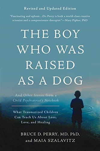 Book cover of "The Boy Who Was Raised as a Dog" with calm lake background and author's name Bruce D. Perry, MD, PhD.