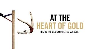 Gymnast performing on uneven bars with "At the Heart of Gold: Inside the USA Gymnastics Scandal" text.