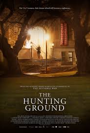 Movie poster for "The Hunting Ground" featuring a nighttime campus scene with a person in the distance walking.