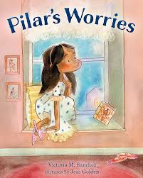 Young girl sitting by a window in pajamas, surrounded by ballet items, looking contemplative. Title: Pilar's Worries.